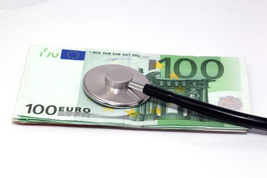 expensive health treatment stethoscope hundred euro banknotes