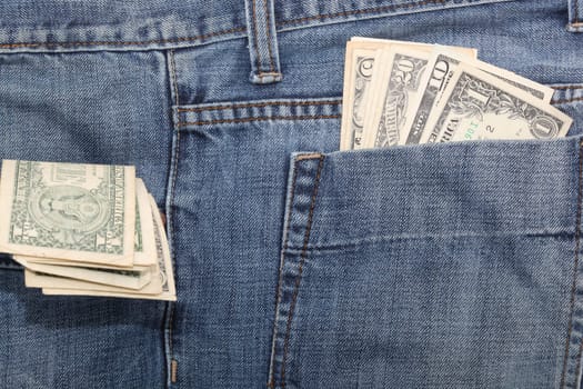 american dollar banknotes in jeans pockets