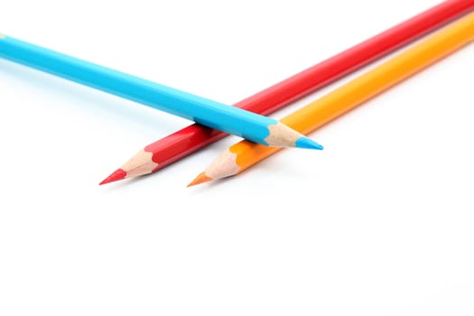 three color pencils with copyspace isolated