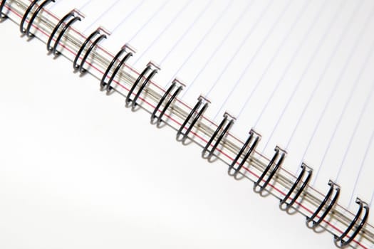 business objects closeup detail of spiral notepad with copyspace
