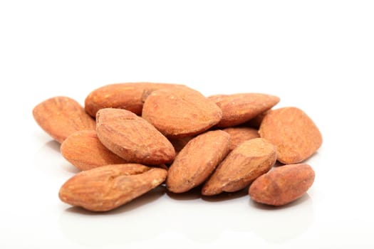 closeup almond nuts roasted and salted with copyspace isolated 