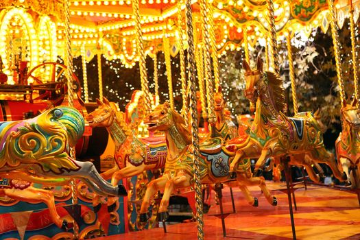 colorful carousel with lights at night
