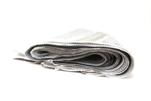 closeup detail from folded newspaper isolated on white background