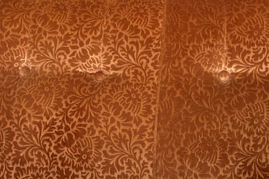 abstract retro golden velvet textile detail with butons from couch 