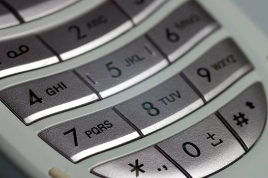 A close up of the key pad on a modern cell phone.