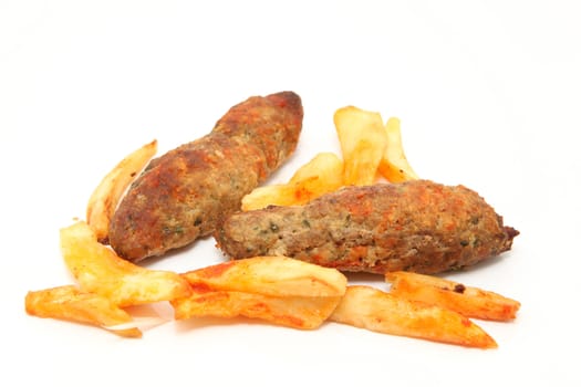 fried potatos and two stakes isolated on white background