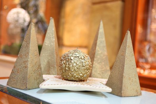 golden xmas decoration candles with soft blur background