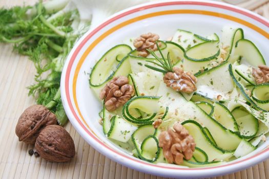a fresh salad of zucchini with walnuts