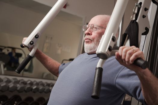 Senior Adult Man Working Out in the Gym.