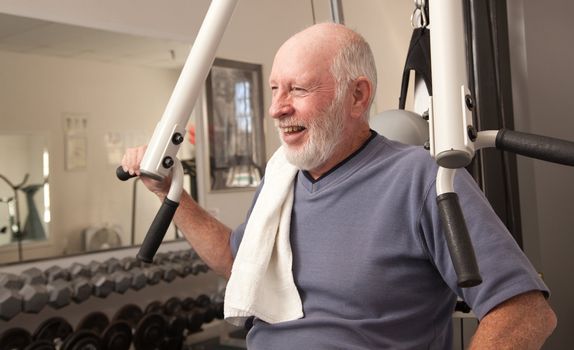 Senior Adult Man Working Out in the Gym.