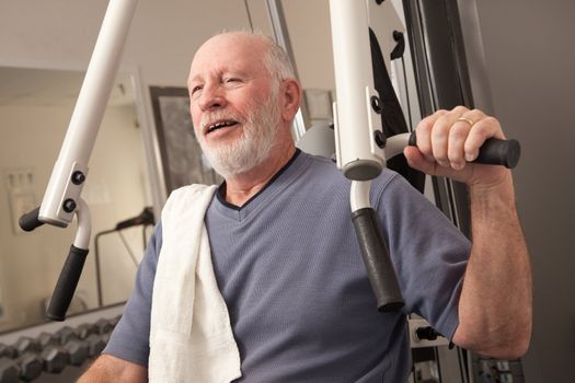 Senior Adult Man Working Out in the Gym.