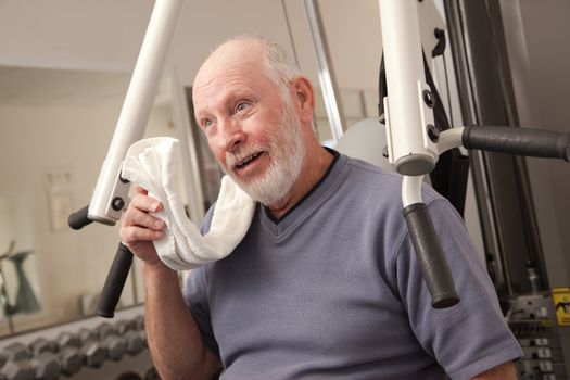 Senior Adult Man Working Out in the Gym.