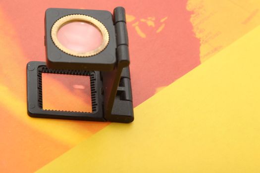 lithography and printing industry magnifaying glass on parer with copyspace