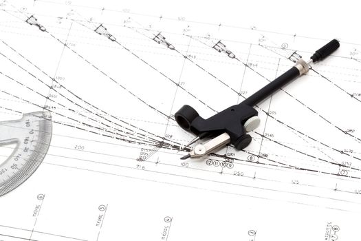 small compas and angle meter on engineering drawings