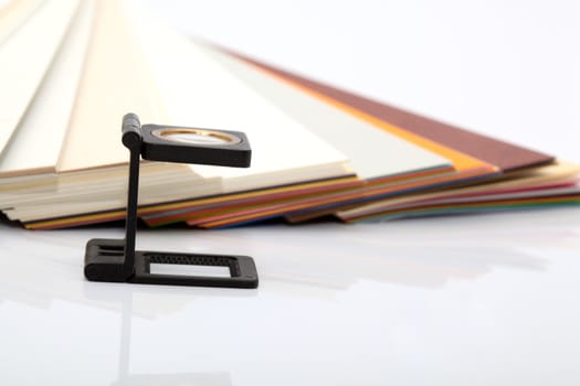paper samples and typographic lense with copyspace