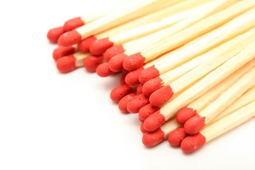 closeup stack of wooden matchsticks with copyspace isolated