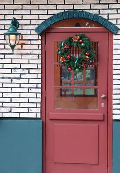 door decorated for xmas with wreath for artificial house athens greece