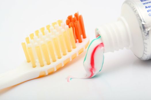 dental hygiene yellow toobrush and toothpaste detail