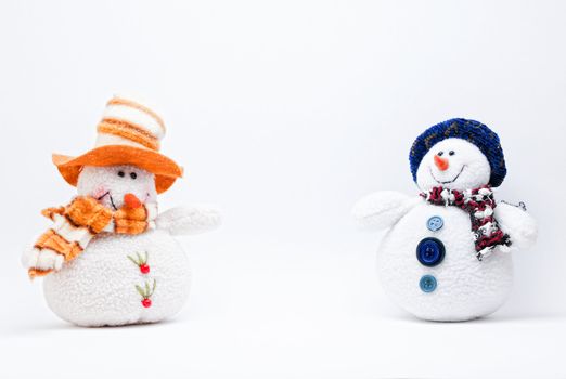 Two Christmas Snowmen on a white background.