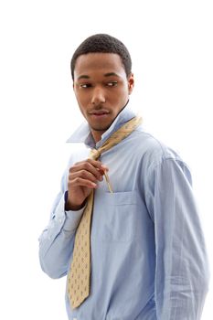 Handsome African American male in blue shirt and yellow tie putting pen in pocket, isolated