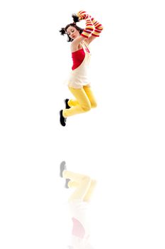 Latina girl wearing red yellow clothes jumping with reflection, isolated