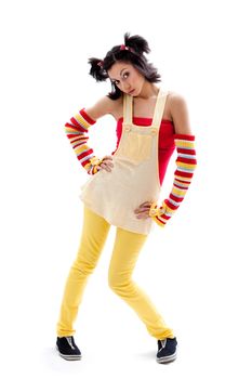 Beautiful fun latina girl with bright colored arm warmers and ponytails with red ribbons in her hair standing with hand on hips, isolated