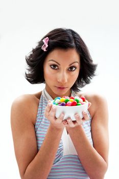 Happy beautiful candy girl with a bowl of colorful bubblegum candy balls, isolated