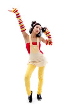 Beautiful fun latina girl with bright colored arm warmers and ponytails with red ribbons in her hair standing with hand in air, isolated