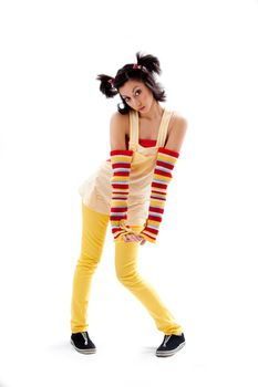 Beautiful fun latina girl with bright colored arm warmers and ponytails with red ribbons in her hair standing with hand down, isolated