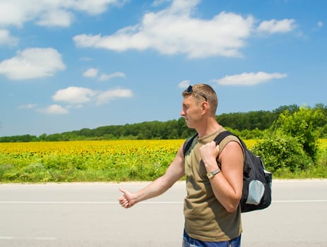 Man stops the car on a road roadside