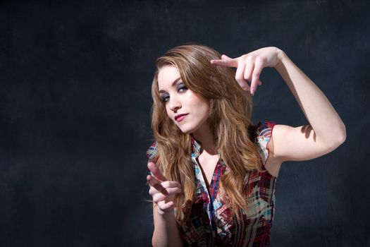 Cool rocker country girl with long dirty-blond hair and an attitude