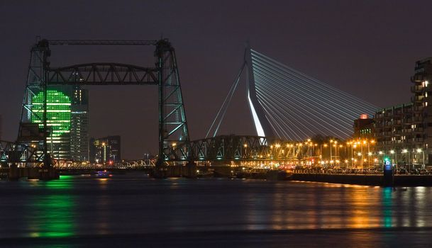 Nightview on Rotterdam with old liftingbridge "Koningshavenbrug" and new bridge Erasmusbridge with KPN building in background