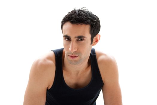 Handsome Caucasian guy wearing black tank top showing bare shoulders and 5 o'clock shadow, isolated