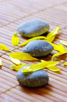 spa stones with flower petals