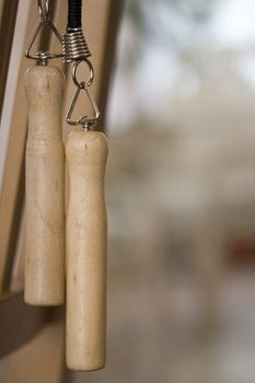 Close-up of two wooden jump rope handles.