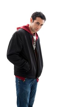 Cool handsome mischievous male wearing a red hoodie, black coat and jeans, with hands in pocket and head down, isolated