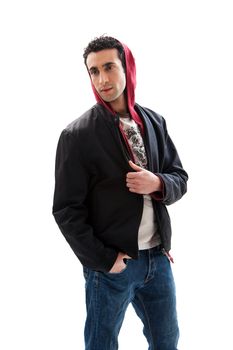 Cool handsome male wearing a red hoodie, black coat and jeans, with hands in pocket, isolated