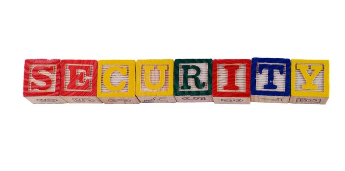 Concept image of child security, by spelling it out with wooden letter blocks