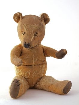1950 teddy bear sitting down.