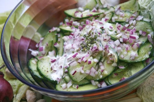fresh salad of cucumbers with red onions