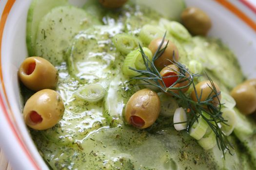 fresh salad of cucumbers with olives