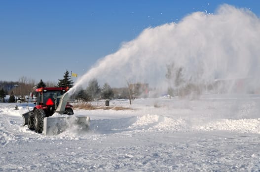 Snow removal on a frozen lake