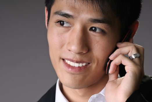Closeup portrait of young business man use cellphone with copyspace.
