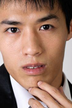 Closeup portrait of young business man face.