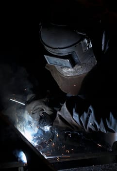a picture of a welder hard at work