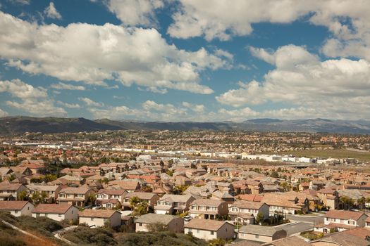 Elevated View of New Contemporary Suburban Neighborhood and Majestic Clouds.