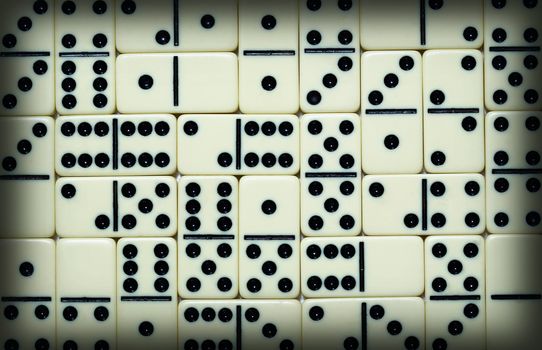 The background from white spotted dominoes pieces