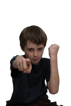 an image of an aggresive young boy with clenched fist and finger pointing forwards.