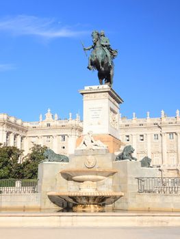 Madrid Plaza de Oriente, statue of Felipe IV. Famous landmark, Madrid, Spain with the Royal Palace, Palacio de Oriente in the background. 