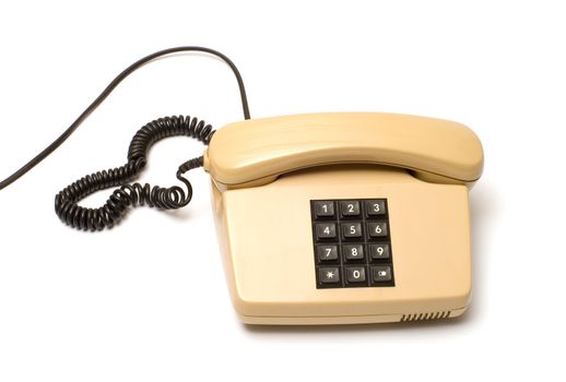 Old Beige key telephone system on a white background.